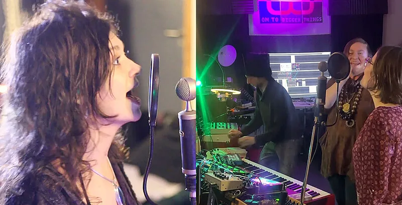 A singer at a microphone beside a live synthesiser and keyboard set-up at a Be Experimental vocal improvisation concert in Bristol